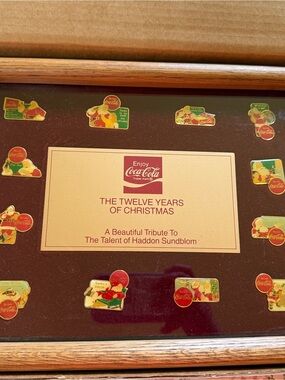 Coca-Cola Holiday Pin Tribute Display in Red and Gold